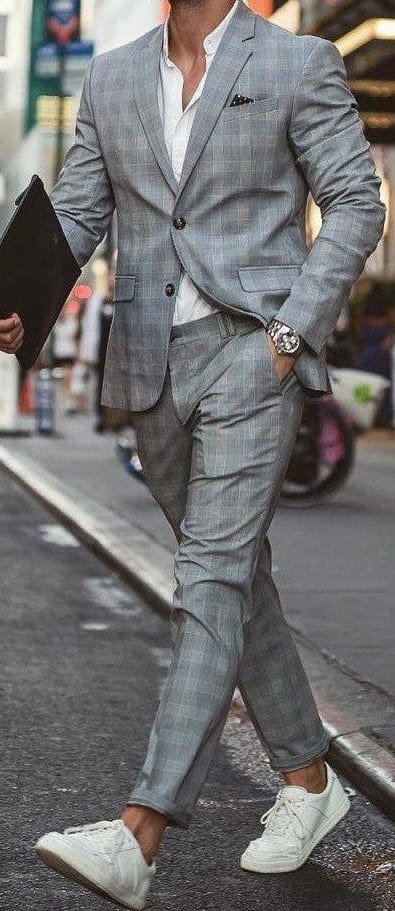 suit with white sneakers